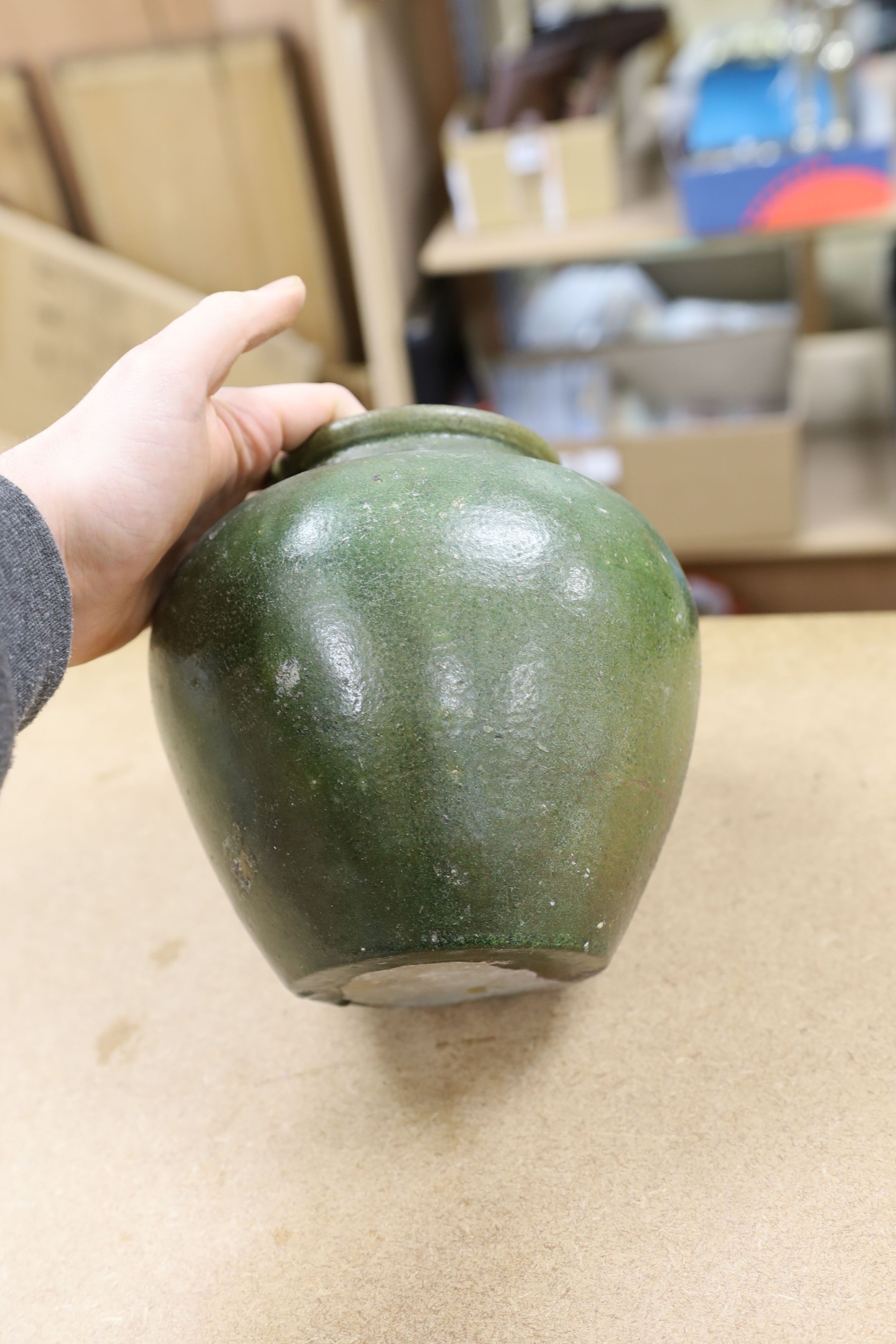 A copper lustre and green glazed pottery jar, 17.5cm high